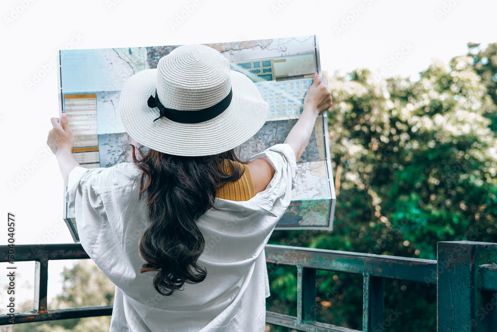 woman traveler tourist looking at map. journey trip travel concept