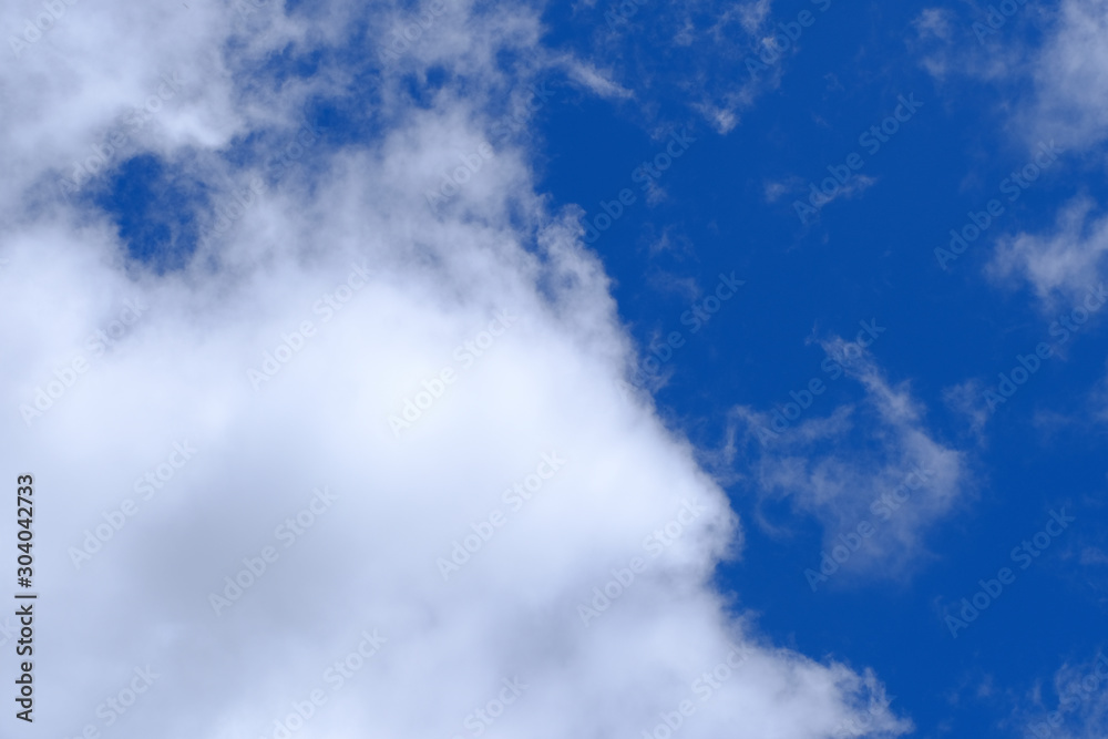 Beautiful blue sky with white gorgeous fluffy cloudy flowing with the wind Beautiful blue sky with white gorgeous fluffy cloudy flowing with the wind