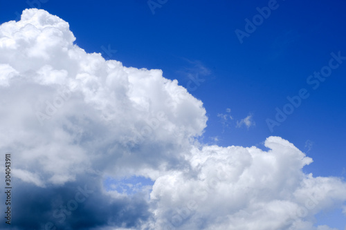 Beautiful blue sky with white gorgeous fluffy cloudy flowing with the wind © 168 Studio