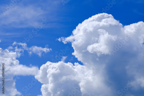 Beautiful blue sky with white gorgeous fluffy cloudy flowing with the wind