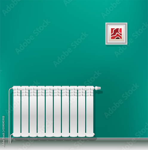 Modern aluminum heating battery hanging on a green blank wall. Housing heating in the winter. Heat saving.