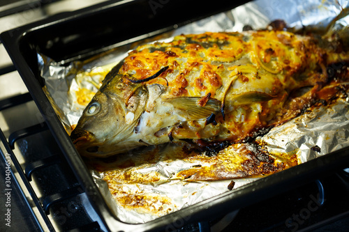 Baked fish with onions and cheese