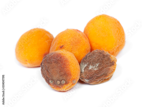 Group of rotten apricots