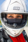View of a beautiful girl from under a motorcycle helmet