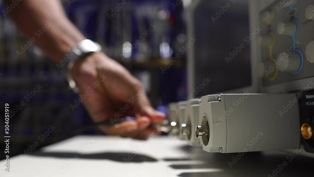 close-up of male engineers are connected to cable systems of communication footage 4K close-up of male engineers are connected to cable systems of communication footage 4K