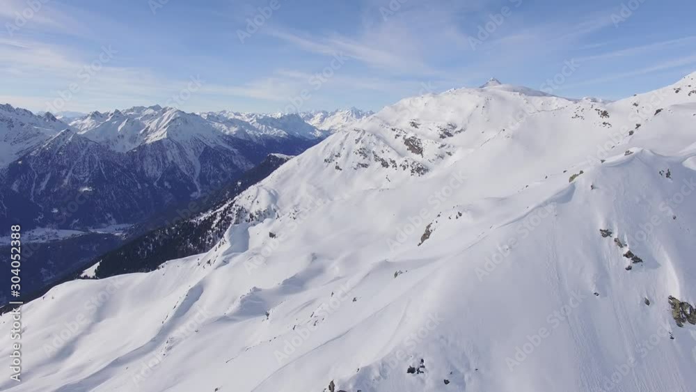 Snowy Swiss Alps. Amazing drone flight over the snowy Swiss mountains, beautiful peaks and ski resorts. Snowy Swiss Alps. Amazing drone flight over the snowy Swiss mountains, beautiful peaks and ski resorts.