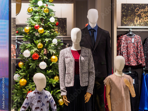 SINGAPORE - 17 NOV 2019 - A Christmas family fashion window display at a Marks & Spencer store