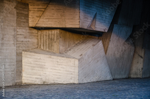 Architectural interior background concrete wall made of geometric shapes