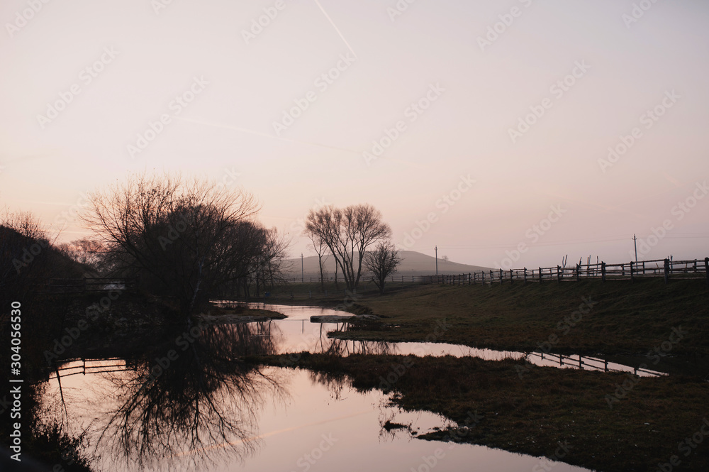beautiful landscape. morning. the river. fog. trees. reflection