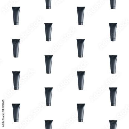  Pattern and texture of the layout. Black tube for cosmetics on a white background.