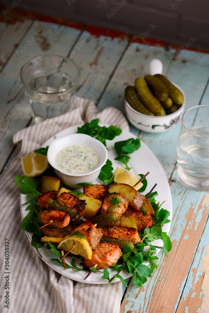 grilled Salmon kebab with green salad .style rustic