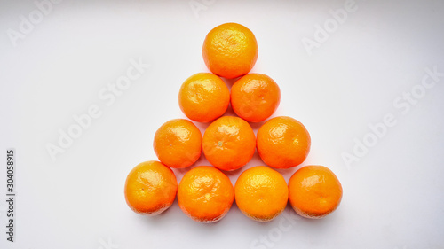 triangle tangerines isolated on white background