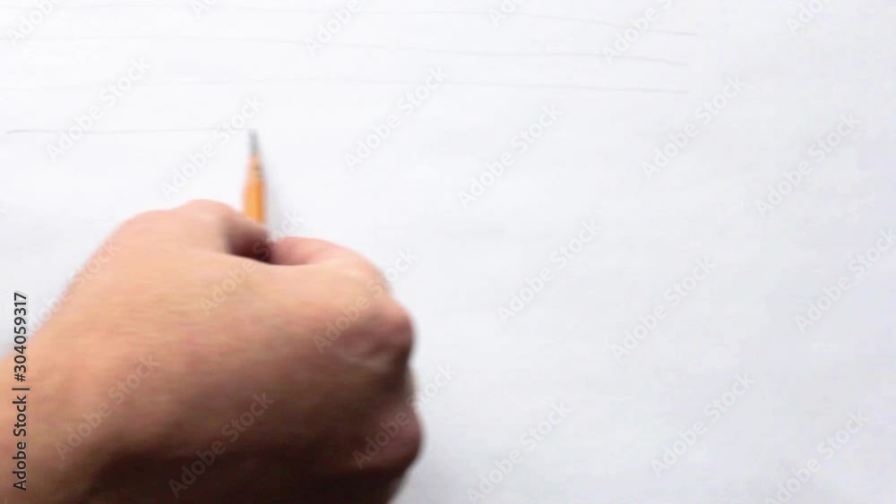 a man's hand draws rough lines on white paper with a simple pencil a man's hand draws rough lines on white paper with a simple pencil