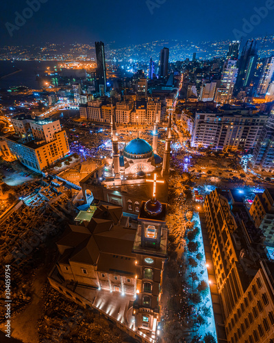 Beirut, Lebanon 2019 : drone shot of Martyr square, showing the st. George Church and Mohammad Al Amine Mosque along with the city skyline in downtown Beirut, during the Lebanese revolution photo