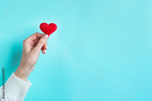 Hand holding Red Heart