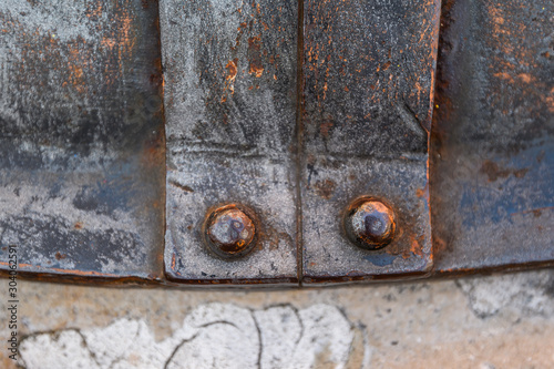 Old metal rivet, texture of old metal, marble. Venice, Italy. © Vladimir