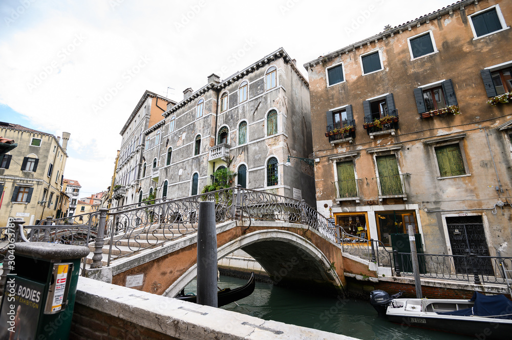 09.10.2019 Venice, Italy, Historic city center, bridge over a narrow canal.