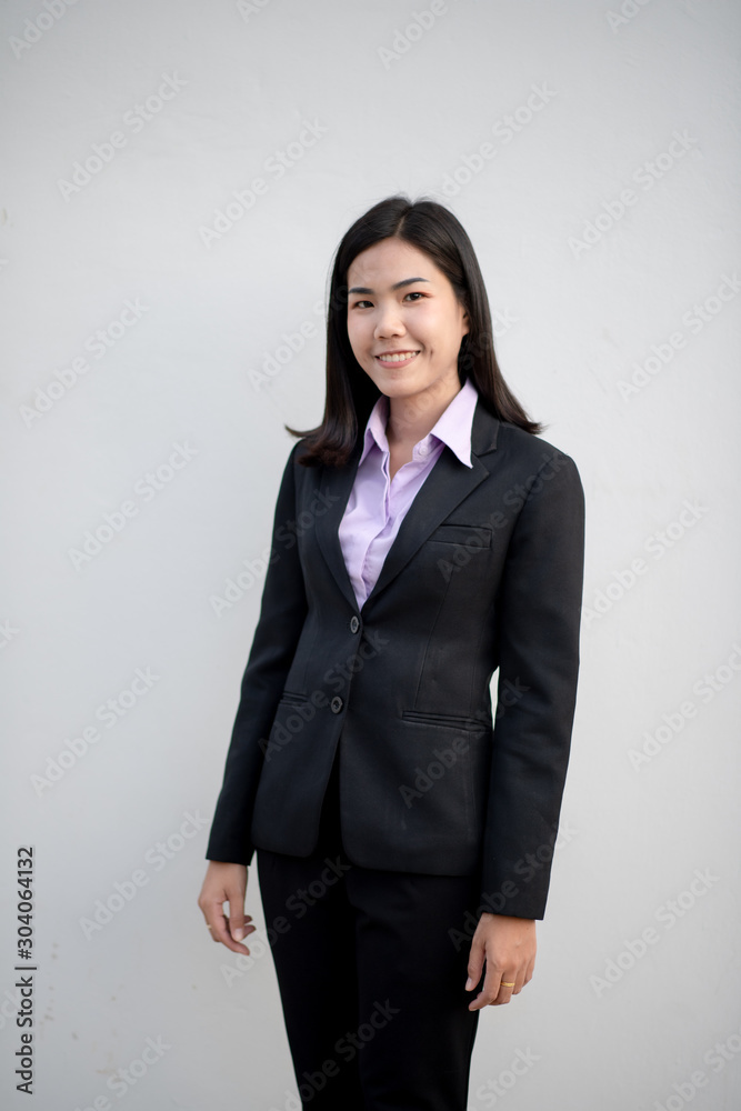 Smiling manager welcoming warm personality bright big smile in large building Smiling manager welcoming warm personality bright big smile in large building