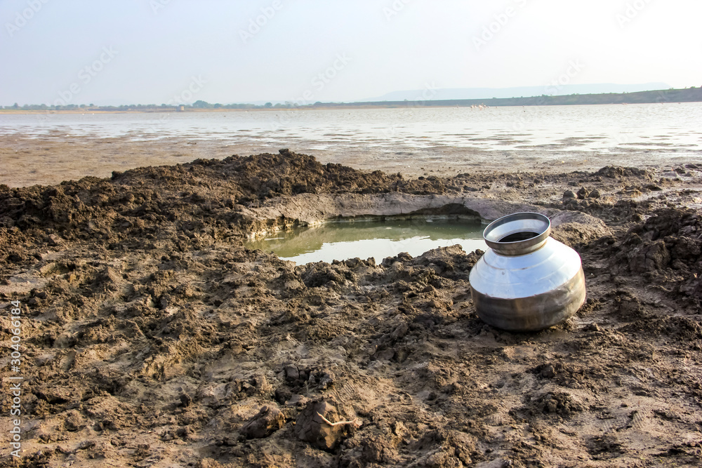 Water pool and steel drum for water storage on river side Water pool and steel drum for water storage on river side