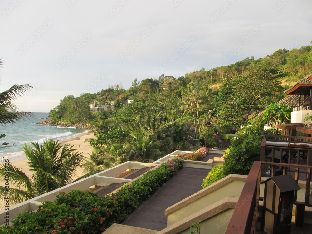 beautiful view from the balcony of the hotel on the ocean, palm trees and the beach. Luxury resort.