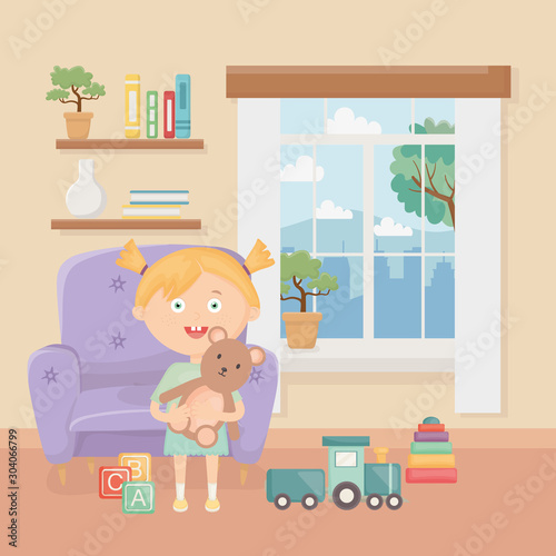 smiling little girl with toys in the living room