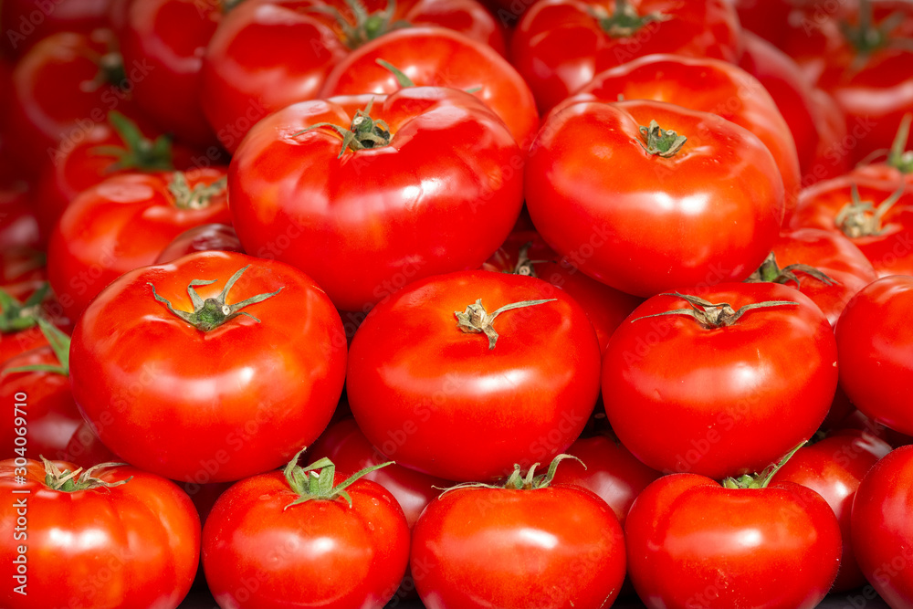 Close-up view of fresh juicy tomatoes, background photography. Summer agriculture farm market tray full of organic tomatoes Close-up view of fresh juicy tomatoes, background photography. Summer agriculture farm market tray full of organic tomatoes
