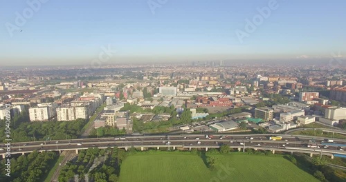 Milan, Italy. Outskirts of the city from the eastern side of the motorway, with the skyline in the distance. photo