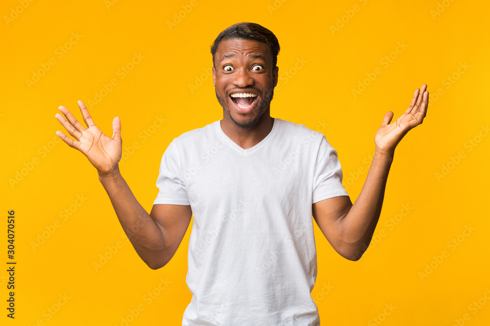 Excited Man Screaming In Delight Standing Over Yellow Background Excited Man Screaming In Delight Standing Over Yellow Background