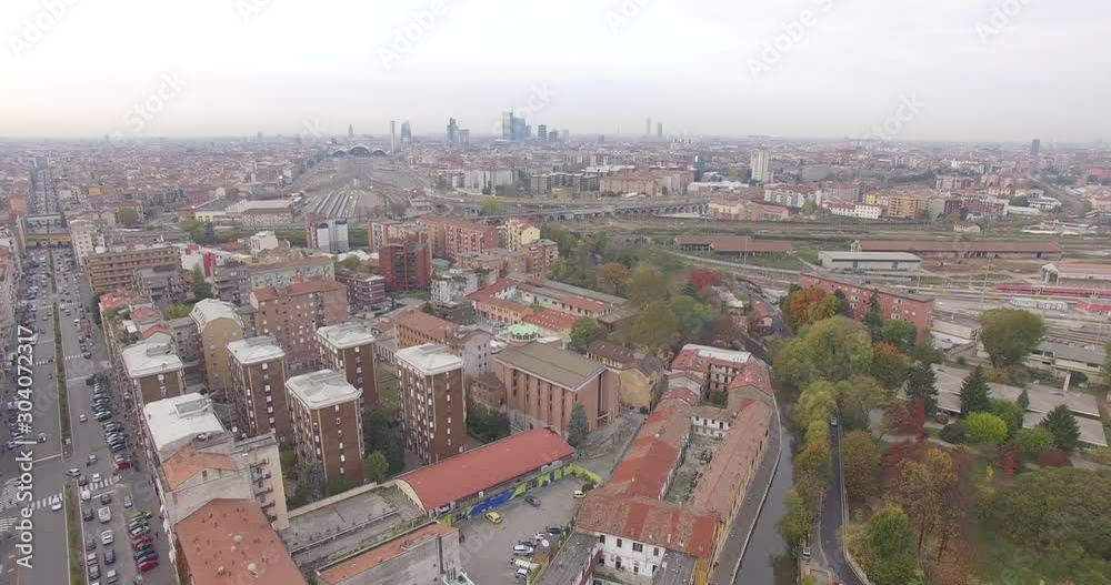 Milan, Italy. An amazing flight over the busy boulevard of Viale Monza, in Milan, view of the city center and it's skyscrapers. Milan, Italy. An amazing flight over the busy boulevard of Viale Monza, in Milan, view of the city center and it's skyscrapers.