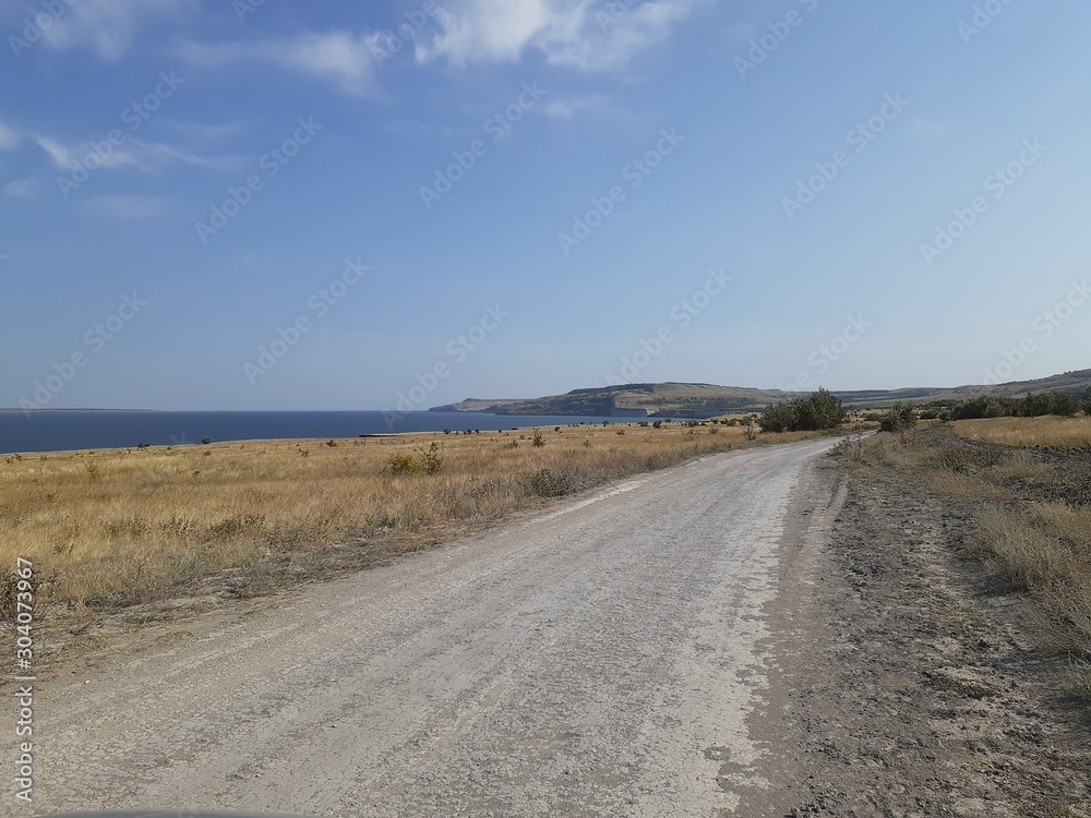 road to the hills in the steppe road to the hills in the steppe