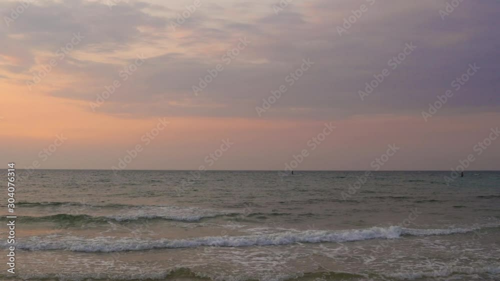 Wide angle seascape view looking straight into the sunset horizon, ocean at the sunset time and cloudy sky, Gorgeous panoramic view of a colorful orange and purple sunrise over Arabian or Persian gulf Wide angle seascape view looking straight into the sunset horizon, ocean at the sunset time and cloudy sky, Gorgeous panoramic view of a colorful orange and purple sunrise over Arabian or Persian gulf