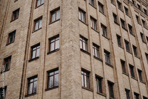 Brick wall and windows of building © vitleo