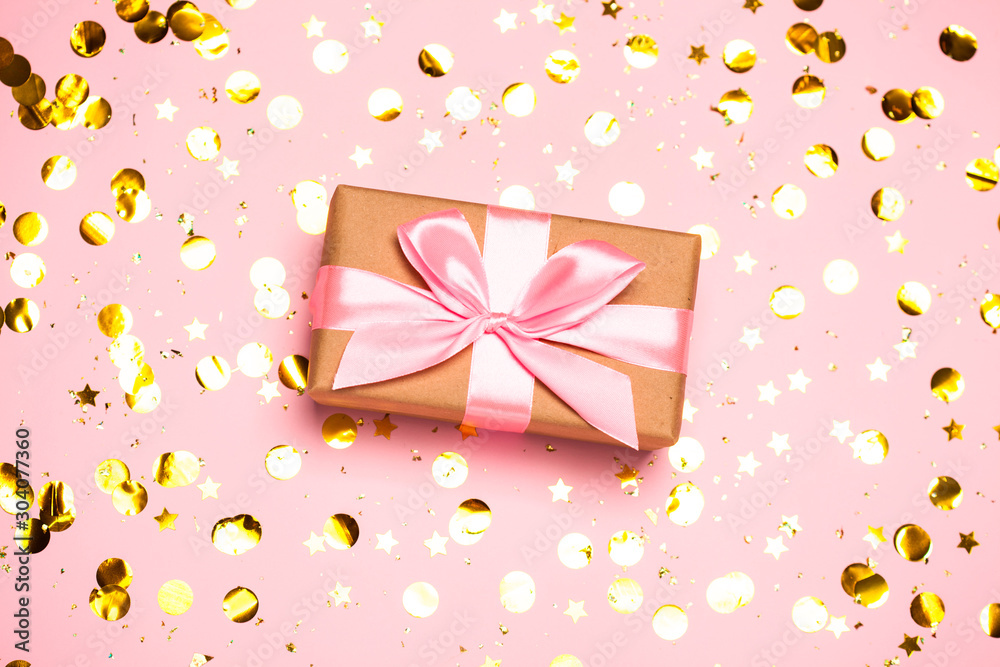 Christmas background with purple balls and present gift box and decoration on pink background. Christmas background with purple balls and present gift box and decoration on pink background.