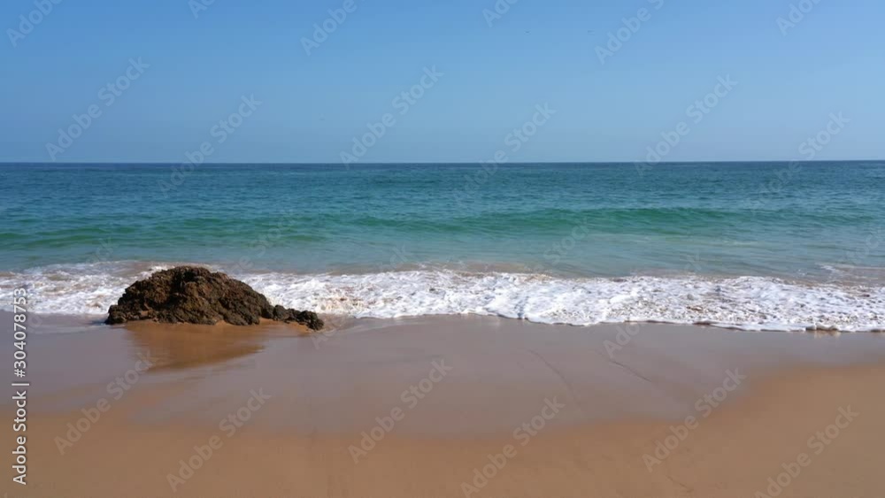 Waves on the beaches and shores of Portugal in the Algarve region Waves on the beaches and shores of Portugal in the Algarve region