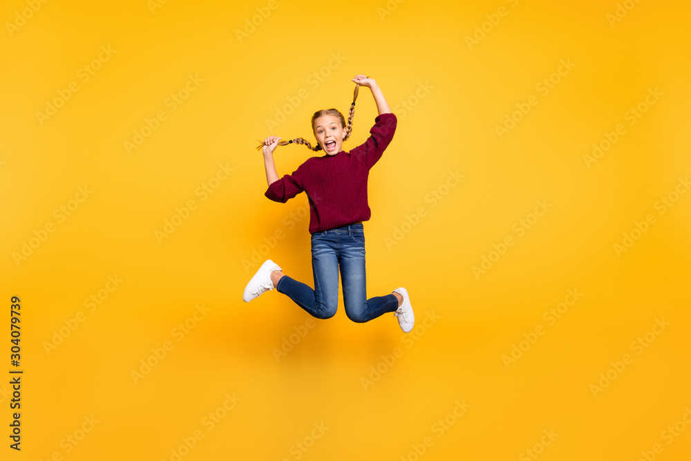 Full length body size view of nice attractive overjoyed cheerful cheery foolish playful pre-teen girl having fun jumping isolated on bright vivid shine vibrant yellow color background