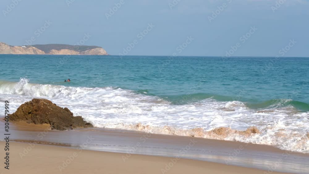 Waves on the beaches and shores of Portugal in the Algarve region Waves on the beaches and shores of Portugal in the Algarve region