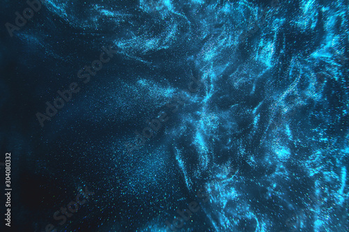 Fototapeta Abstract elegant, detailed blue glitter particles flow with shallow depth of field underwater