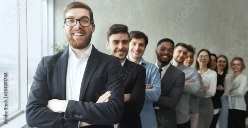 Young diverse business team posing with crossed arms