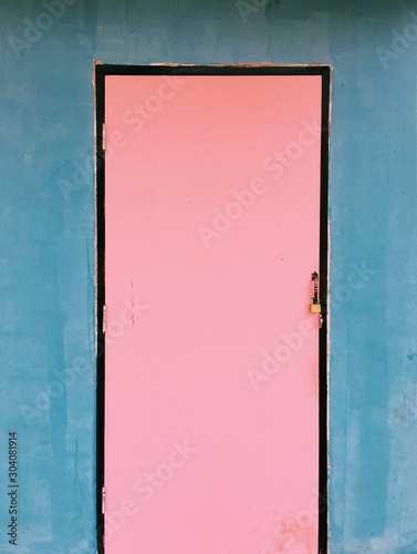old blue door with red paint