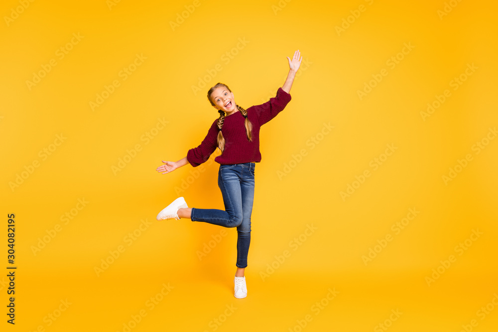 Full length body size view of nice attractive lovely cheerful cheery girlish carefree careless pre-teen girl having fun dancing isolated over bright vivid shine vibrant yellow color background Full length body size view of nice attractive lovely cheerful cheery girlish carefree careless pre-teen girl having fun dancing isolated over bright vivid shine vibrant yellow color background