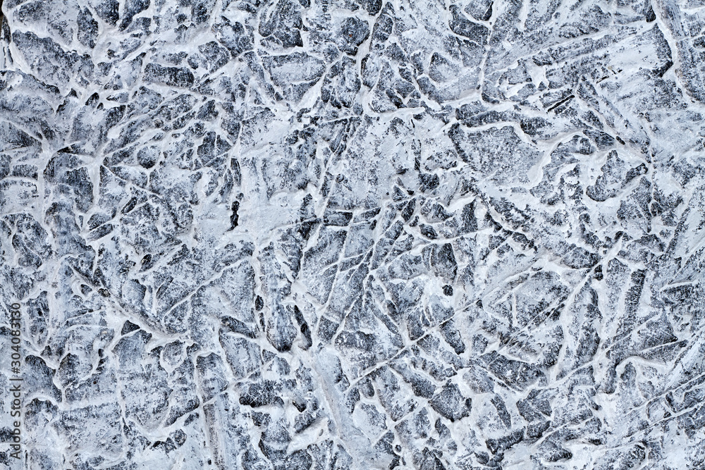 Obraz premium Gray grooved stucco on wall. Plaster patterned texture or background. Closeup