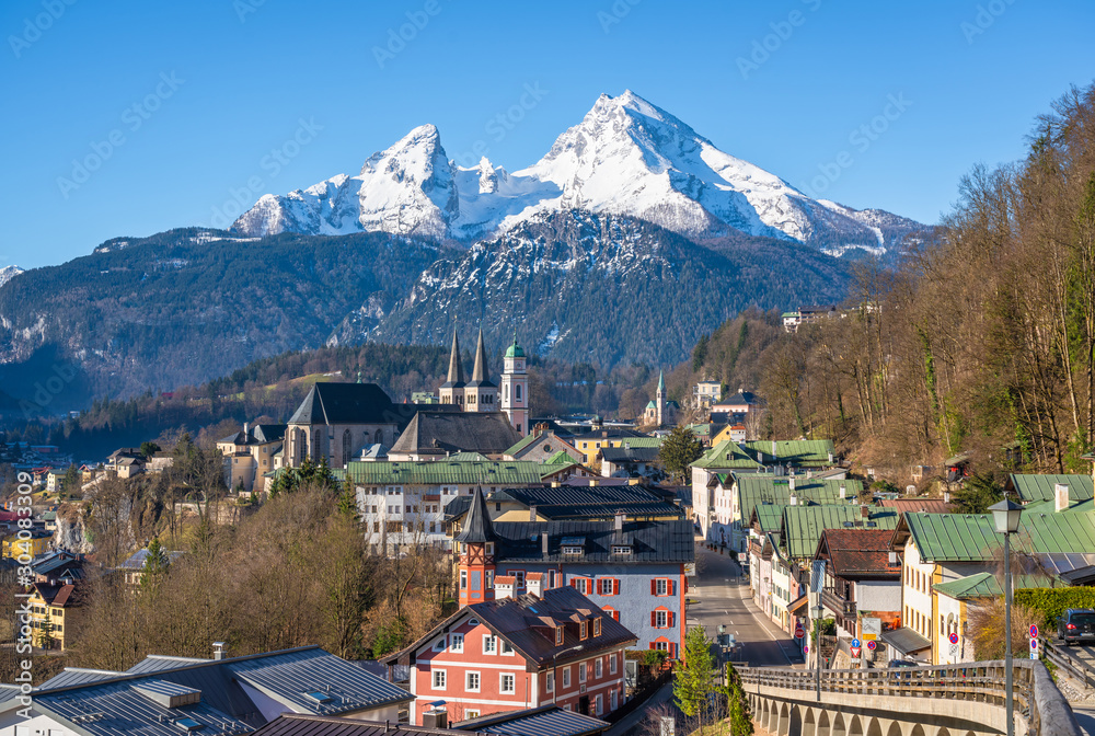 Classic panoramic view of historic old town of Berchtesgaden with famous snow-capped Watzmann mountain top on a beautiful sunny day in early spring, Berchtesgadener Land, Upper Bavaria, Germany
