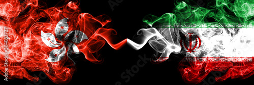 Hong Kong, China vs Iran, Iranian smoky mystic states flags placed side by side. Concept and idea thick colored silky abstract smoke flags photo