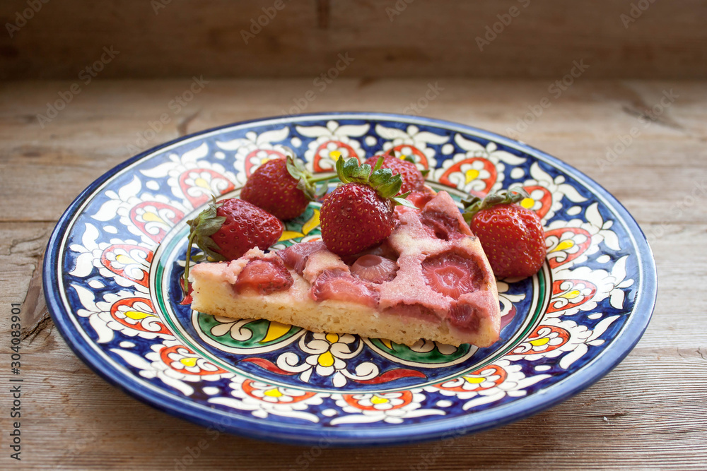 Round strawberry pie with fresh strawberries slice on plate dish on wooden table background Round strawberry pie with fresh strawberries slice on plate dish on wooden table background