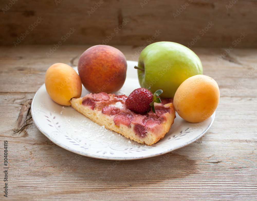 Round strawberry pie with fresh strawberries slice on plate dish on wooden table background Round strawberry pie with fresh strawberries slice on plate dish on wooden table background