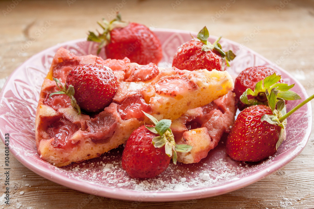 Round strawberry pie with fresh strawberries slice on plate dish on wooden table background Round strawberry pie with fresh strawberries slice on plate dish on wooden table background