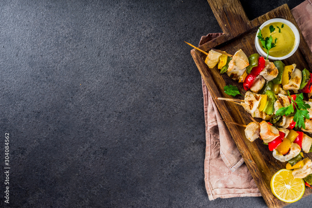 Homemade chicken meat skewers with vegetables, top view copy space Homemade chicken meat skewers with vegetables, top view copy space