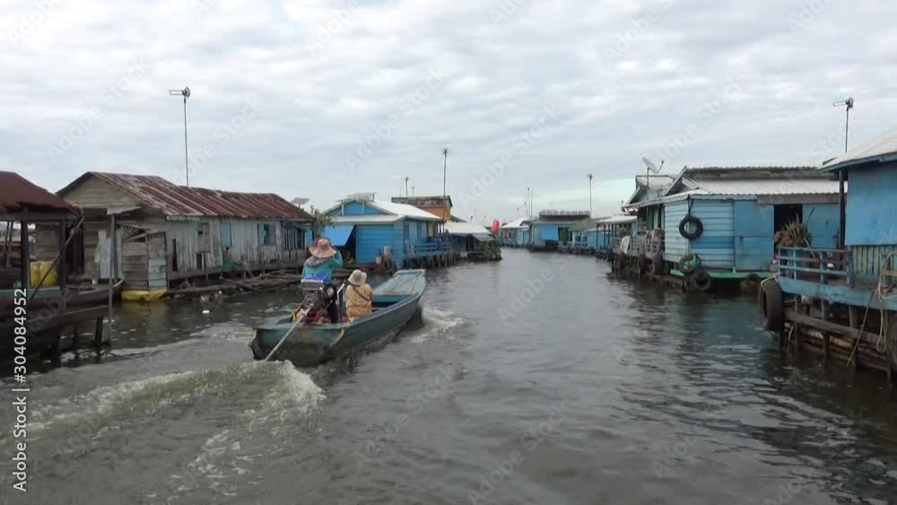 onle Sap, Cambodia - December 31th 2016: Daily life in the Cambodian village of Ponley, on the banks of the Tonle Sap lake. onle Sap, Cambodia - December 31th 2016: Daily life in the Cambodian village of Ponley, on the banks of the Tonle Sap lake.
