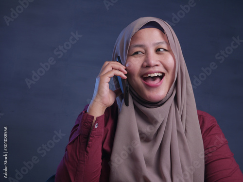 Muslim Lady Talking on Phone  Smiling Expression
