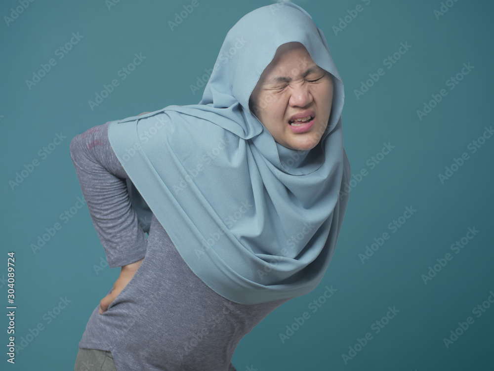 Muslim Woman Having Lower Back Pain Muslim Woman Having Lower Back Pain